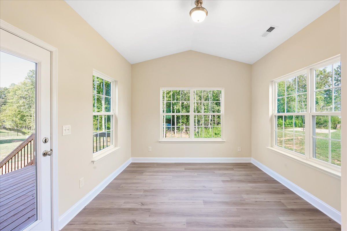 https://assets.windsorhomes.us/img/Midland II_D_RFM_lot24_6512_Rogers_Farm_Rd_sun_room.jpg